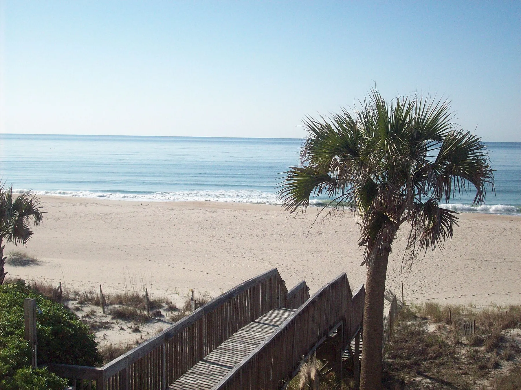 A wooden walkway over the dune down to the beach at Ocean Isle Beach