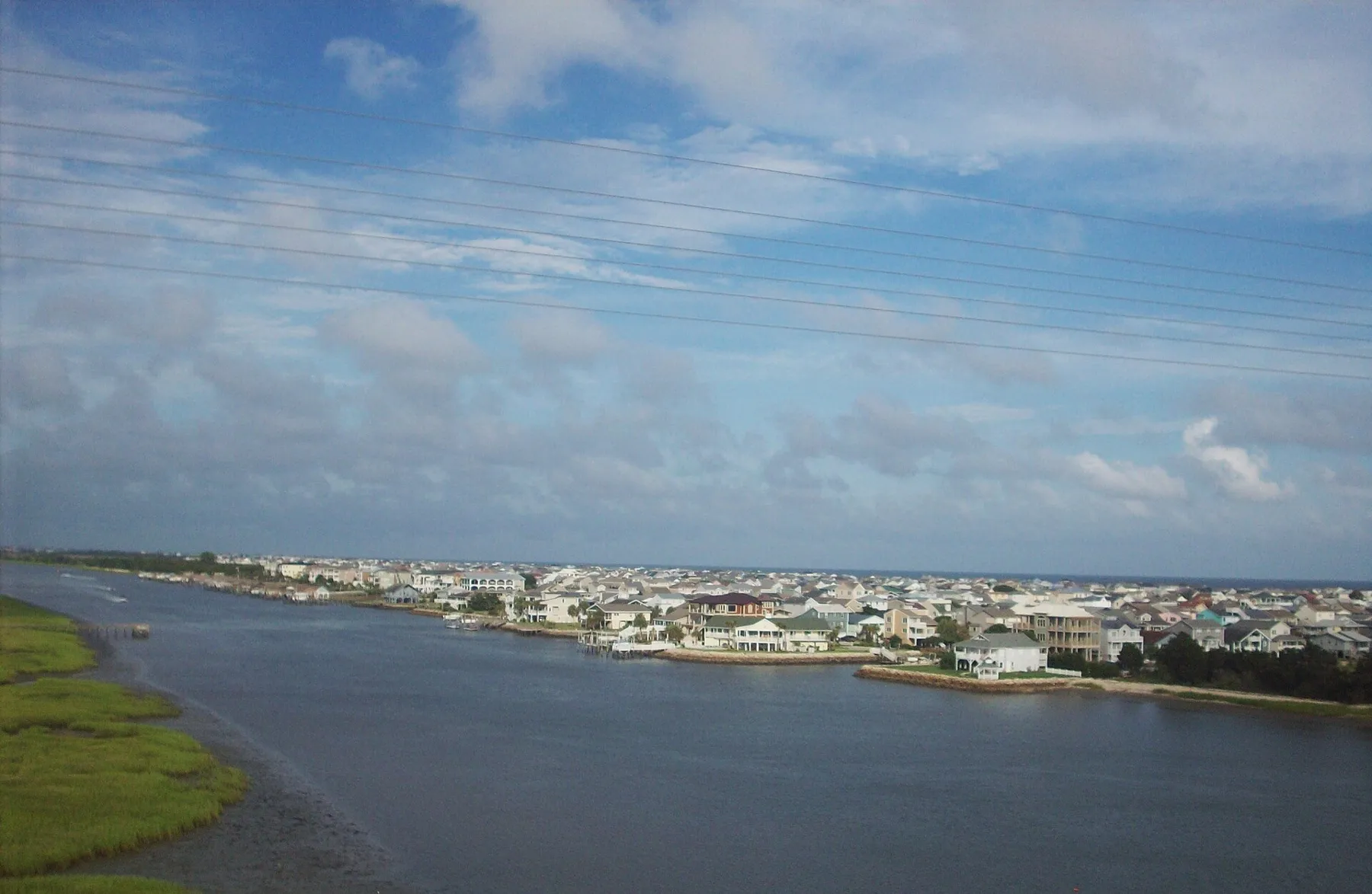 Ocean Isle Beach seen from the bridge, with the waterway and the island's houses